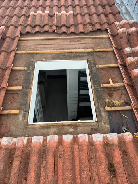 Roof window and slate repairs, photograph 2