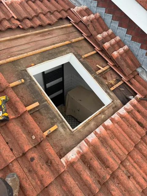 Roof window and slate repairs, photograph 9
