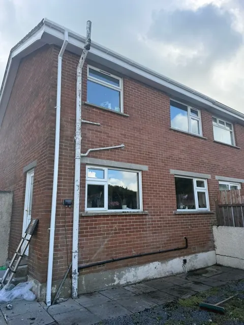White PVC roofline installation, photograph 1